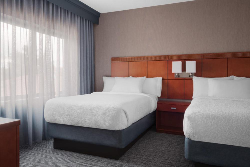 One-Bedroom Suite with Two Double Beds and Sofa Bed interior